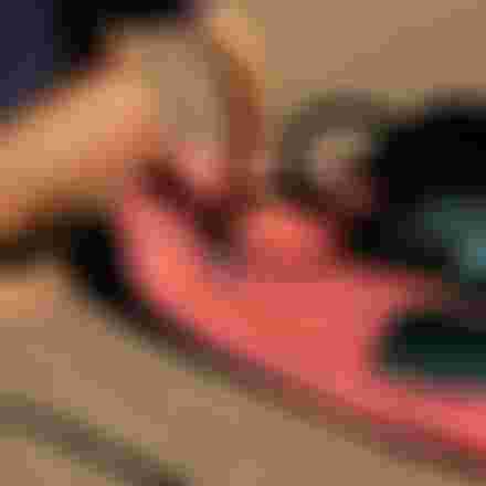 Girl inflating an SZP Board with electric air pump