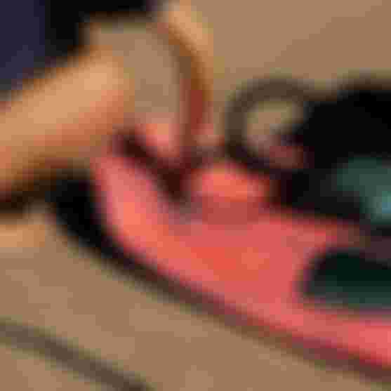 Girl inflating an SZP Board with electric air pump