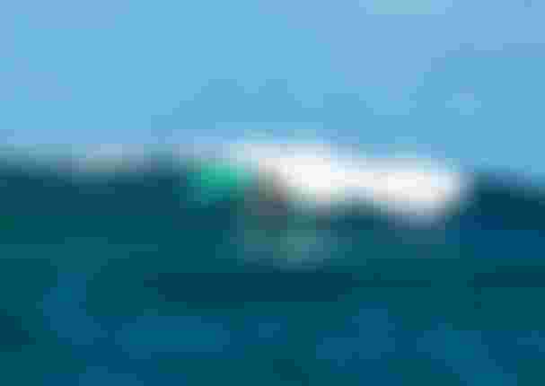 MariaBehrens riding a wave on SkyStyle SS26 and Unit26 on Guadeloupe