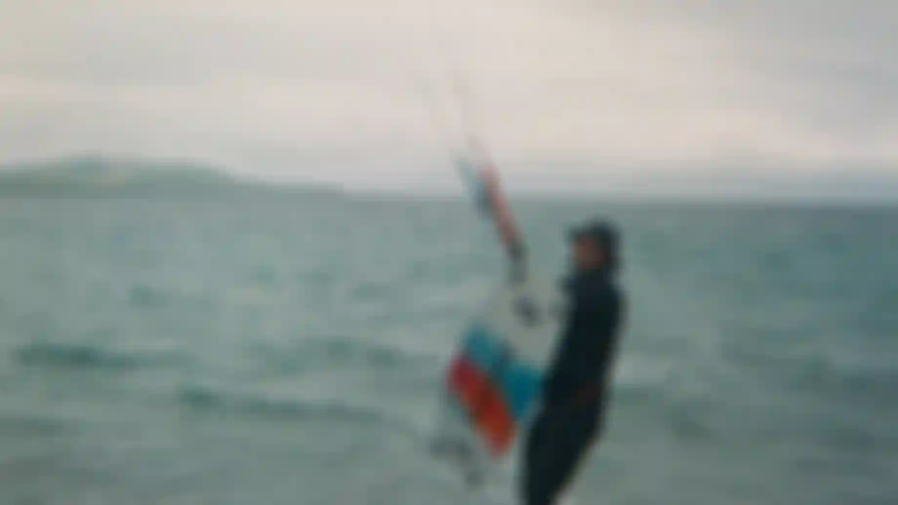 a man with a kiteboard