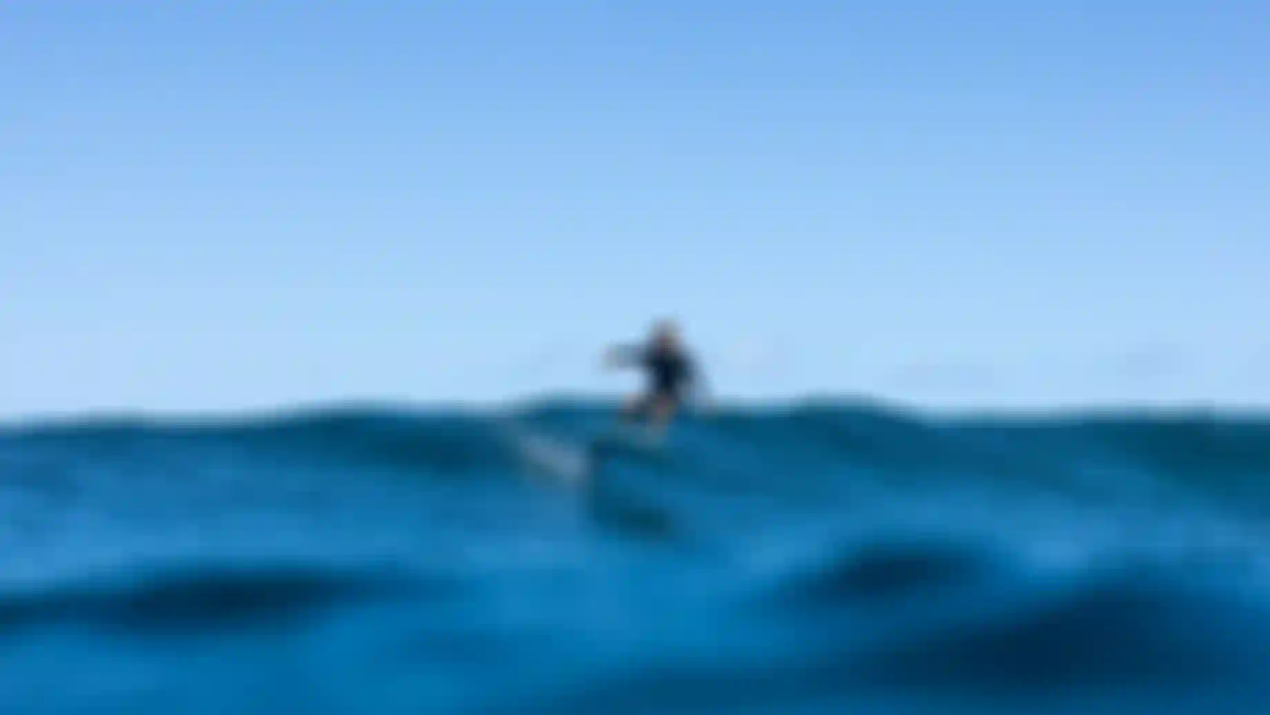 Leo Etienne surfing on a wave