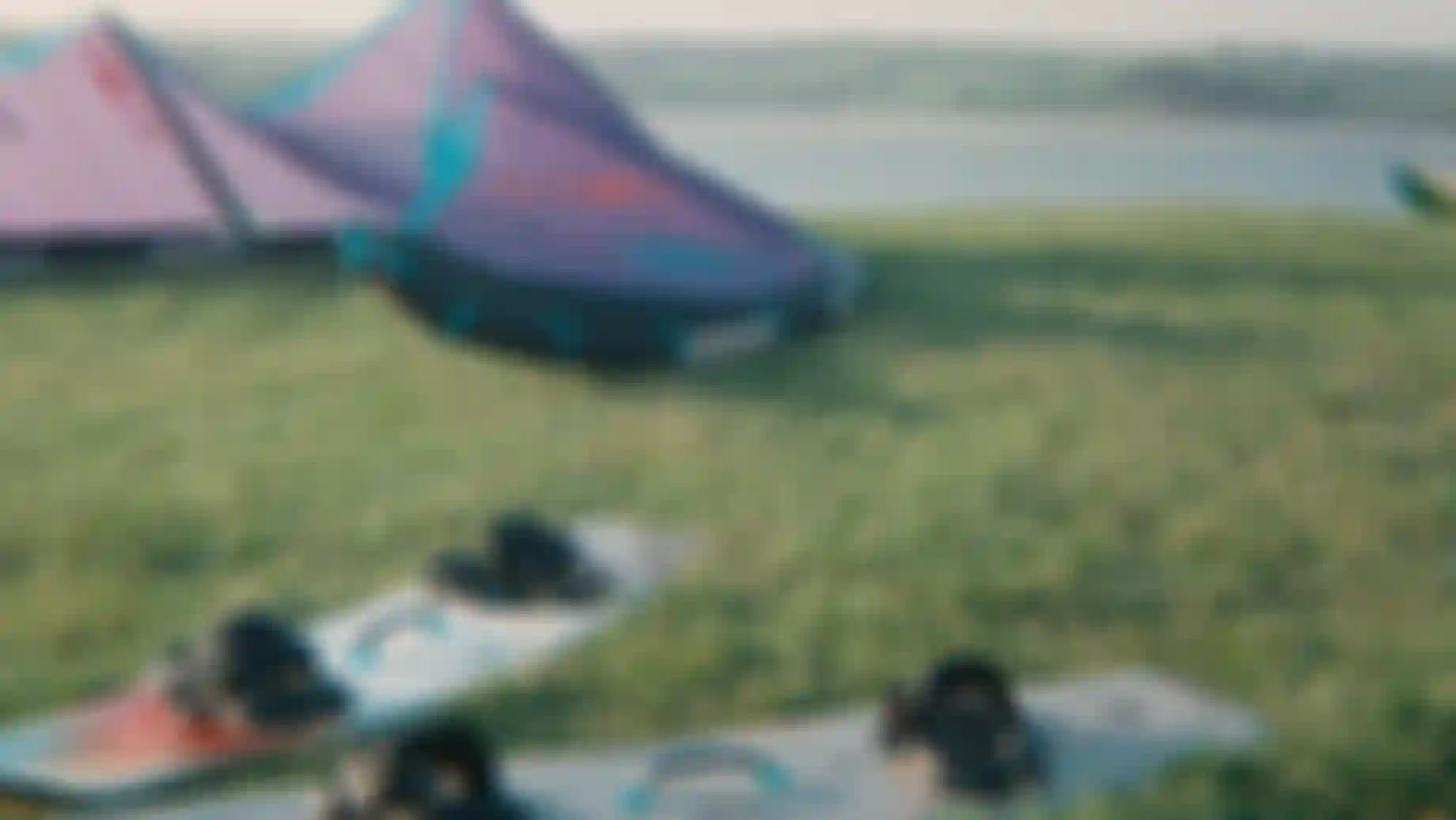 two kiteboards and a kite