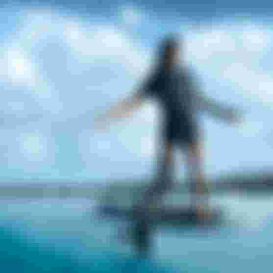 Mo Chauvin surfing on a wave with the Foil Assist in Guadeloupe