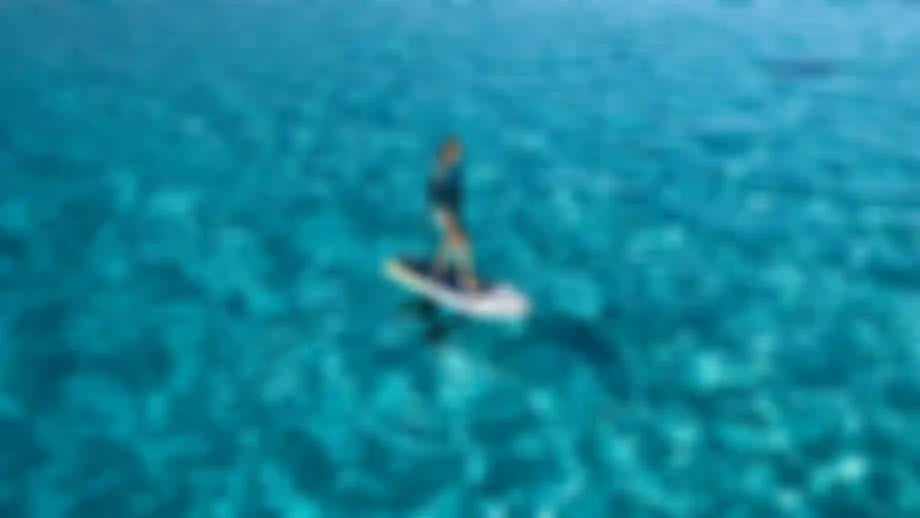 Melissa cruising on flat water with the Foil Cruise