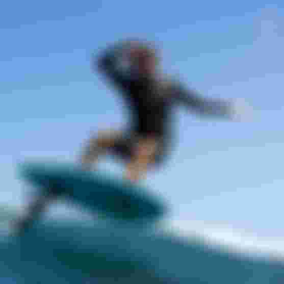 Leo Etienne carving on a wave