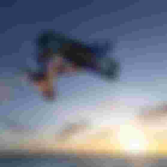 Freestyle Kitesurfer in the sunset with Duotone equipment