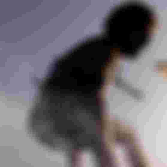 Matchu is having fun when kitesurfing in a wave