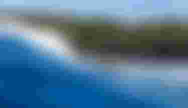 Finn Spencer riding a wave on Guadeloupe with Crush SLS