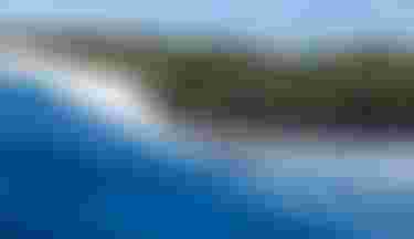 Finn Spencer riding a wave on Guadeloupe with Crush SLS