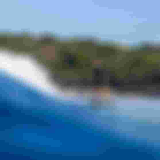 Finn Spencer riding a wave on Guadeloupe with Crush SLS