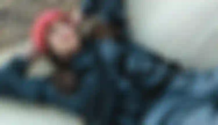 Woman with a red beanie and a sweater
