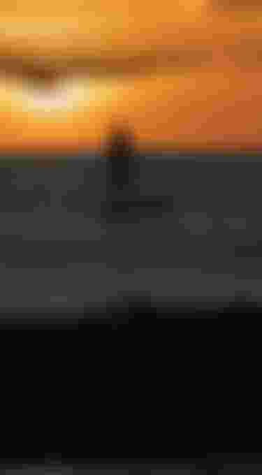 Duotone Stand Up Paddle riders paddle into the sunset