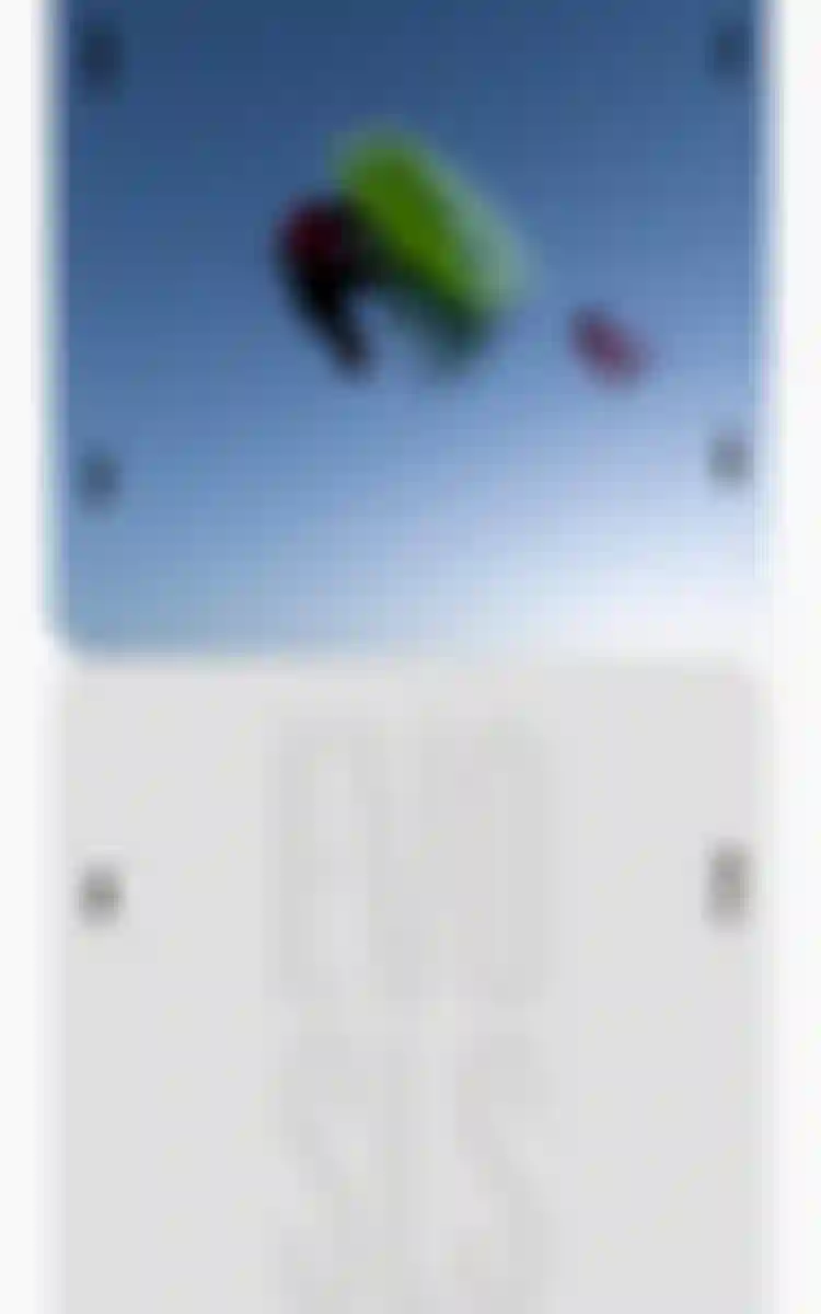 Rider mid-air trick with a Duotone kiteboard against a clear blue sky, with text reading "Take Your Riding To The Next Level – EVO SLS"