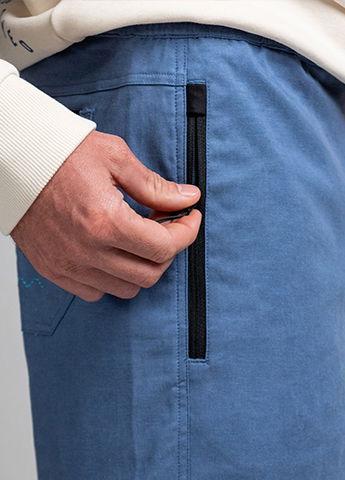 2 zip pockets on front, one patched on pocket on back (easy entry pocket)