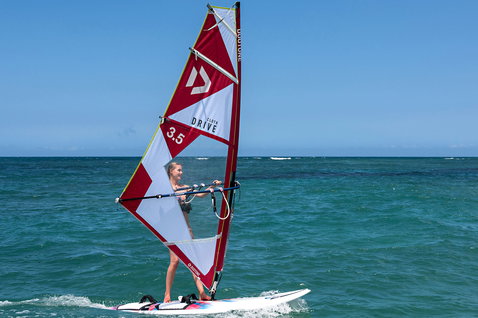 Duotone Drive Cloth freeride sail during freeriding at an ocean beach