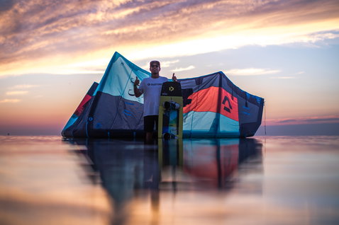 Duotone Dice LEI kite during kitesurfing on the ocean at sunset