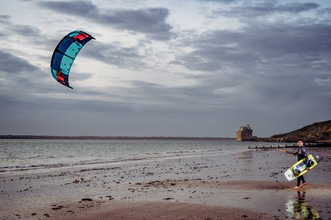 Duotone Dice LEI kite during kitesurfing at the ocean beach