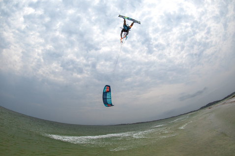 Duotone Dice LEI kite during kitesurfing on an ocean beach