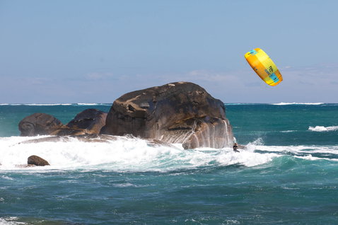 Duotone Neo LEI kite during wave riding at the rocky ocean coastline in Australia