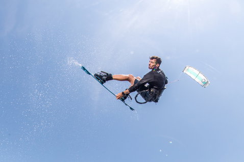 Duotone Vegas LEI kite during kitesurfing over open water under open sky