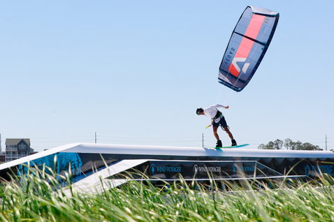 Duotone Boot wakestyle kiteboard boot during wakestyle at a coastal flatwater kite park