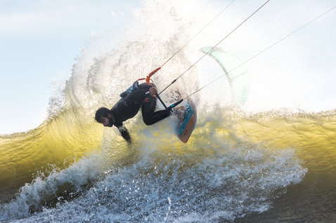 Duotone Wam wave kiteboard during kitesurfing on an ocean wave