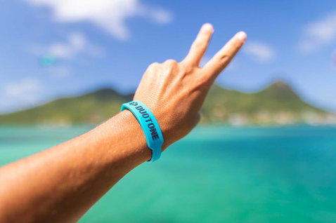 Duotone Wristband wristband during a standing pose on a tropical island ocean beach