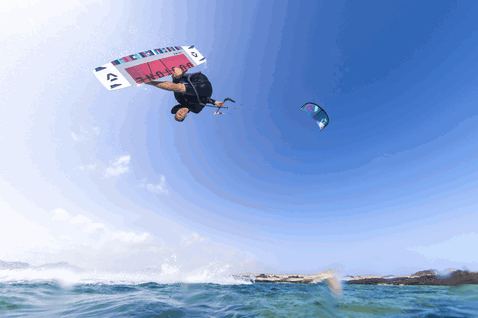 Duotone Dice SLS LEI kite during kitesurfing at the ocean beach