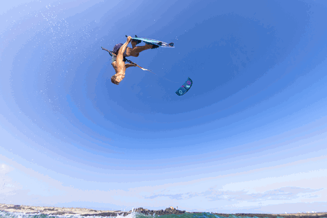 Duotone Dice SLS LEI kite during kitesurfing at the ocean beach