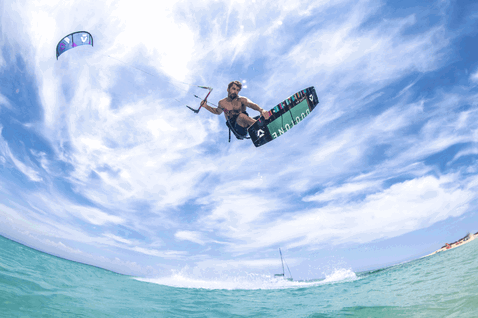 Duotone Dice SLS LEI kite during kitesurfing at a tropical ocean beach