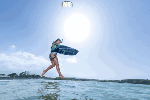Duotone Dice SLS LEI kite during kitesurfing in an ocean lagoon with tropical shoreline