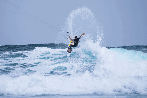 Duotone Whip D/LAB kite surfboard during kitesurfing on open water ocean waves