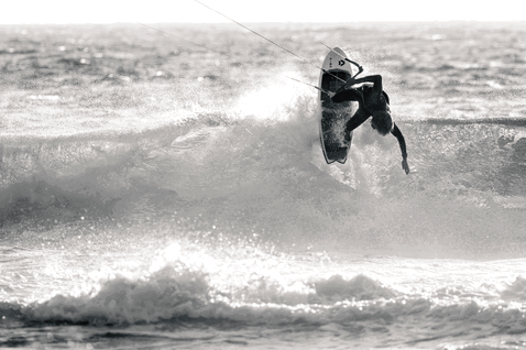 Duotone Fish SLS kite surfboard during kitesurfing at the ocean beach