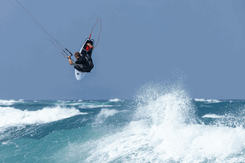 Duotone Fish SLS kite surfboard during kitesurfing at the ocean beach