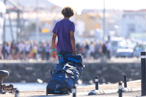 Duotone Combibag 2024 kite and board travel bag during kitesurfing at coastal harbour
