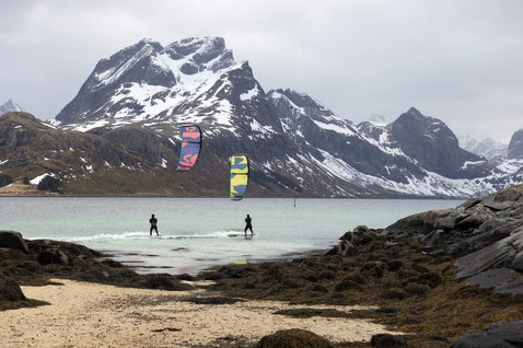 Duotone Dice SLS LEI kite during kitesurfing in a fjord at the Lofoten Islands Norway