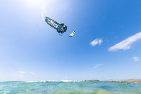 Duotone Jaime twin-tip kiteboard during kitesurfing at the ocean beach
