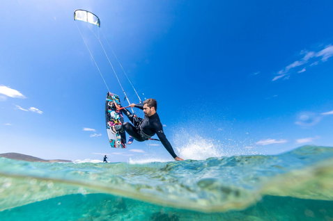 Duotone Jaime SLS twin-tip kiteboard during kitesurfing on the ocean beach