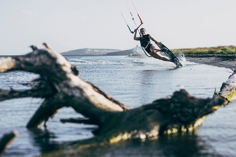 Duotone Soleil twin-tip kiteboard during kitesurfing in a coastal lagoon in Sardinia