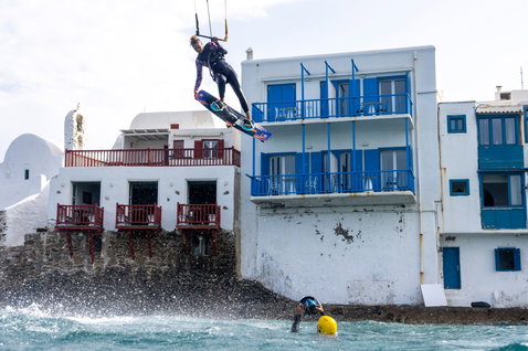 Duotone Select SLS twin-tip kiteboard during kitesurfing at Mediterranean coastal waterfront in Greece