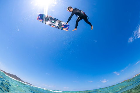 Duotone Select SLS twin-tip kiteboard during kitesurfing at the ocean beach