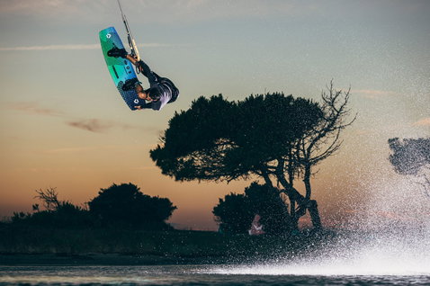 Duotone Team Series SLS twin-tip kiteboard during kitesurfing at a coastal lagoon in Sardinia
