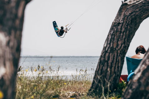 Duotone Team Series SLS twin-tip kiteboard during kitesurfing at the coastal beach of Sardinia
