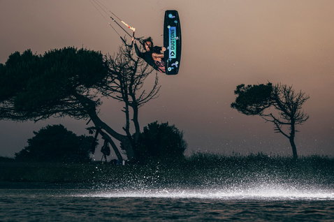 Duotone Team Series SLS twin-tip kiteboard during kitesurfing at a coastal lagoon in Sardinia