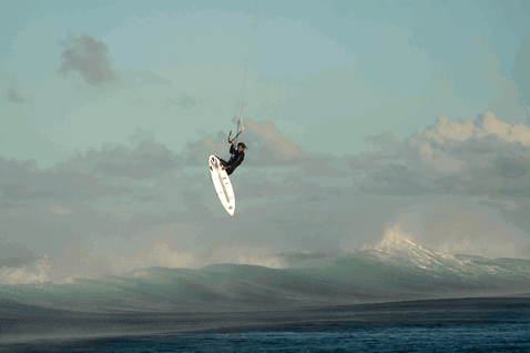 Duotone Session SLS wave kiteboard during kitesurfing at the ocean beach
