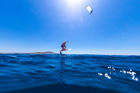 Duotone Hybrid SLS 2024 SLS directional kiteboard during foiling on the open ocean