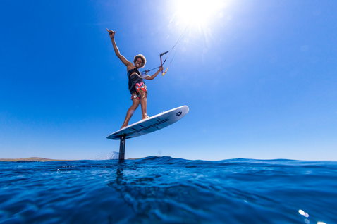 Duotone Hybrid SLS foil kiteboard during foiling on calm open ocean