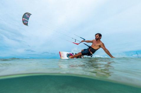 Duotone Spike twin-tip kiteboard during kitesurfing in the lagoon of New Caledonia