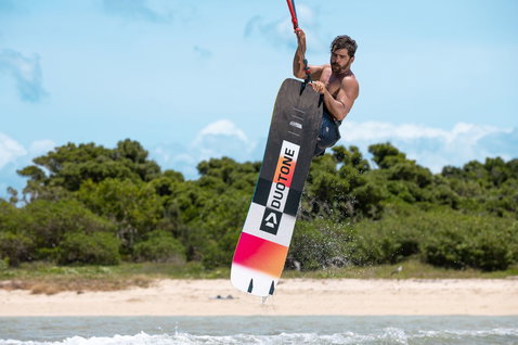 Duotone Ultraspike twin-tip kiteboard during kitesurfing at a tropical beach
