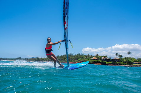 Duotone FreeWave windsurf board during windsurfing on the ocean at a tropical coastline